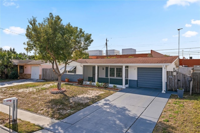 ranch-style house with a front yard and a garage