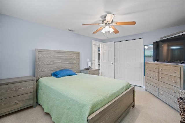 bedroom featuring ceiling fan and a closet