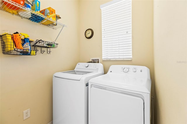 laundry room with washing machine and dryer