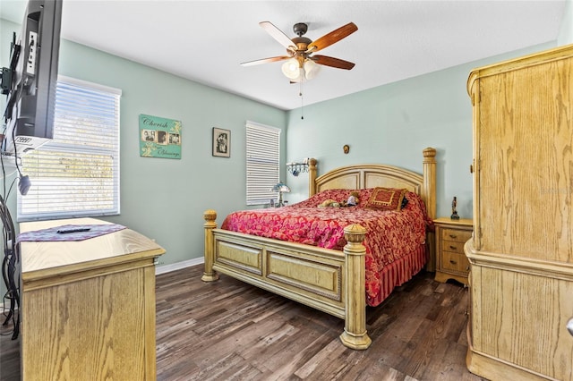 bedroom with ceiling fan and dark hardwood / wood-style flooring