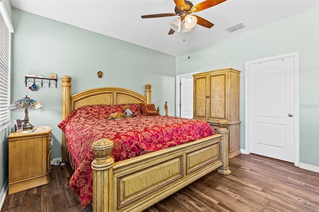 bedroom with dark wood-type flooring and ceiling fan