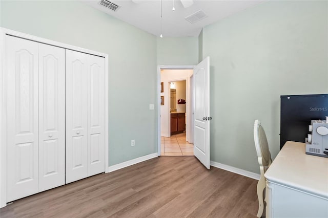 office space featuring ceiling fan and light wood-type flooring