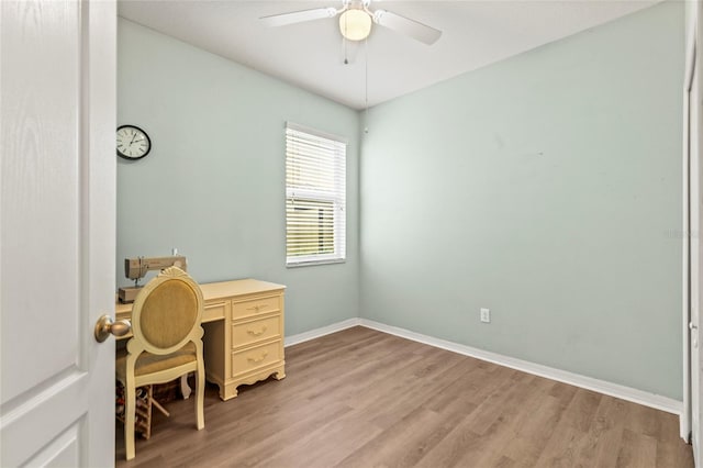 office space featuring ceiling fan and light hardwood / wood-style floors