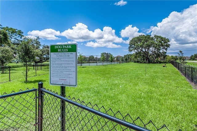 view of community featuring a yard and a water view