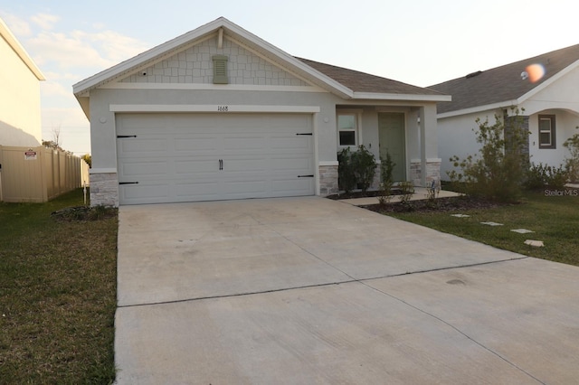 ranch-style home with a garage and a front lawn