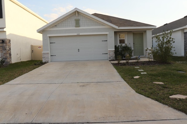 view of front of home featuring a garage and a front yard