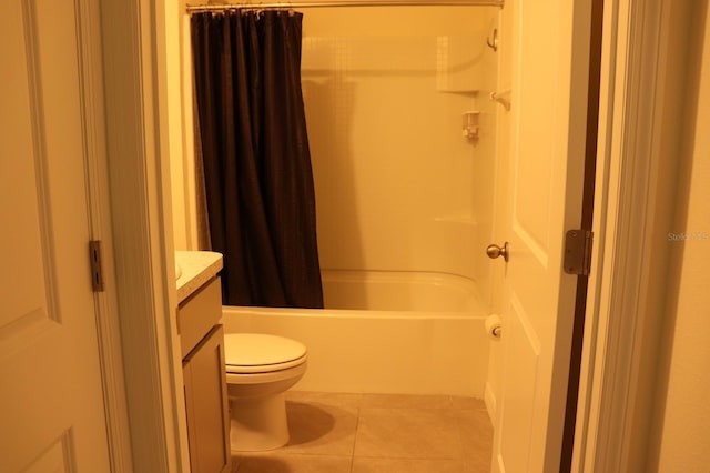 full bathroom with vanity, tile patterned floors, toilet, and shower / tub combo with curtain