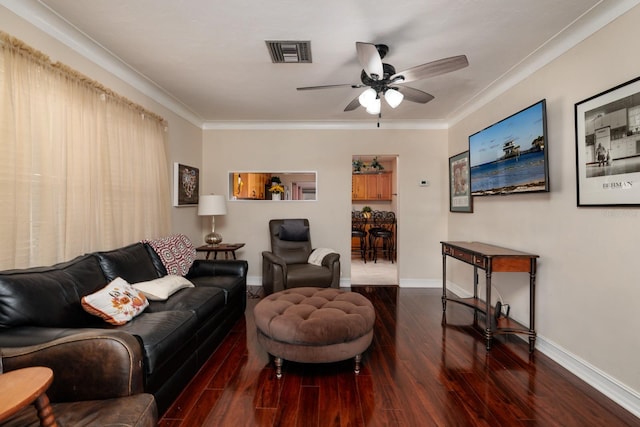 living room featuring ceiling fan, dark wood-type flooring, and ornamental molding