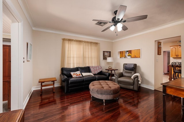 living room with dark hardwood / wood-style floors, ceiling fan, and ornamental molding