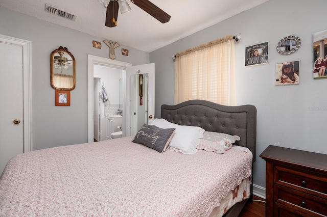 bedroom featuring ceiling fan and ensuite bath