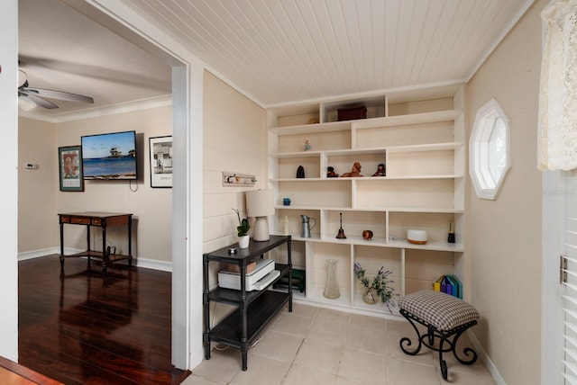 interior space with ceiling fan, crown molding, and wood ceiling