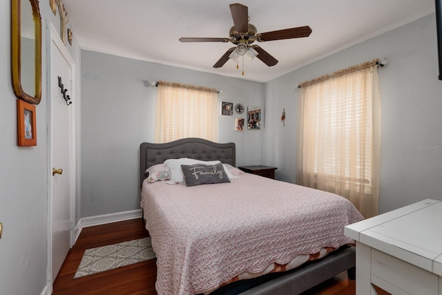 bedroom featuring dark hardwood / wood-style flooring and ceiling fan