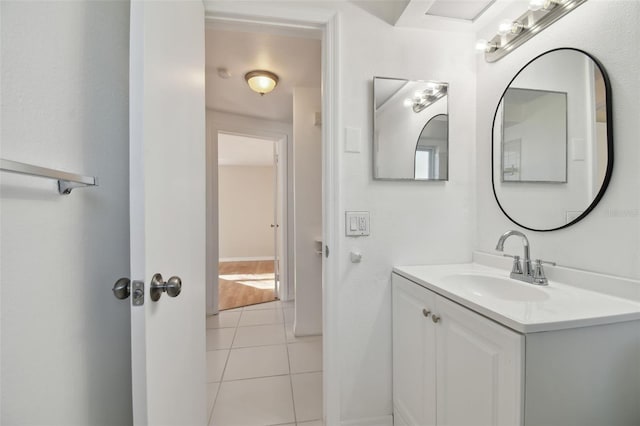 bathroom with tile patterned floors and vanity