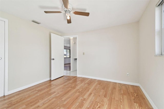 unfurnished room with light hardwood / wood-style floors and ceiling fan