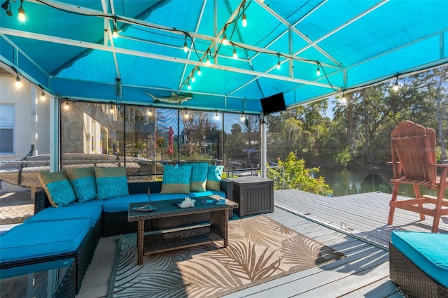 exterior space featuring a water view and outdoor lounge area