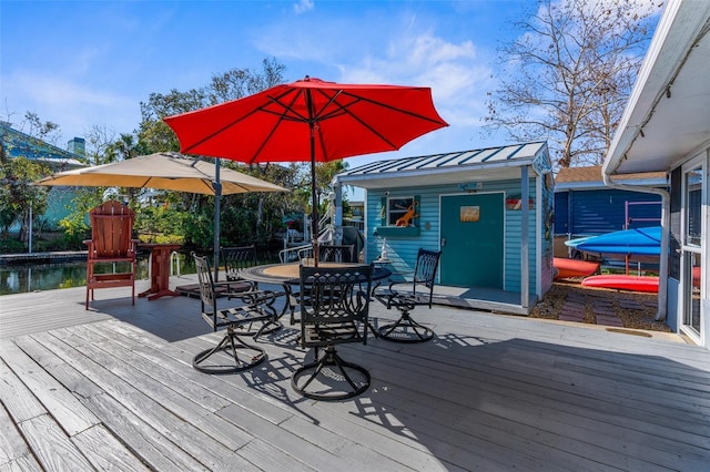 wooden deck featuring a shed