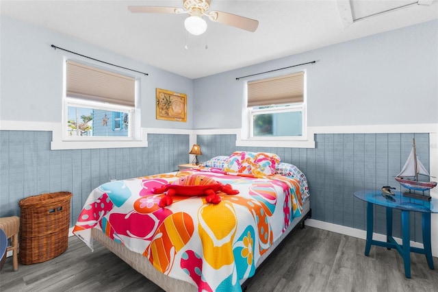 bedroom featuring ceiling fan and dark hardwood / wood-style floors