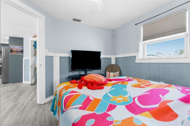 bedroom featuring ceiling fan and light hardwood / wood-style flooring