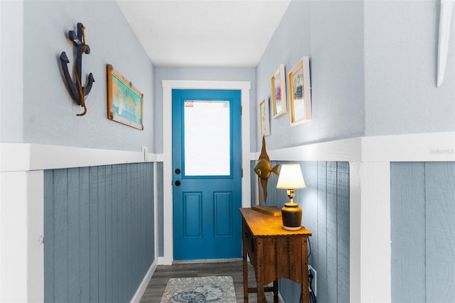 doorway to outside featuring dark wood-type flooring