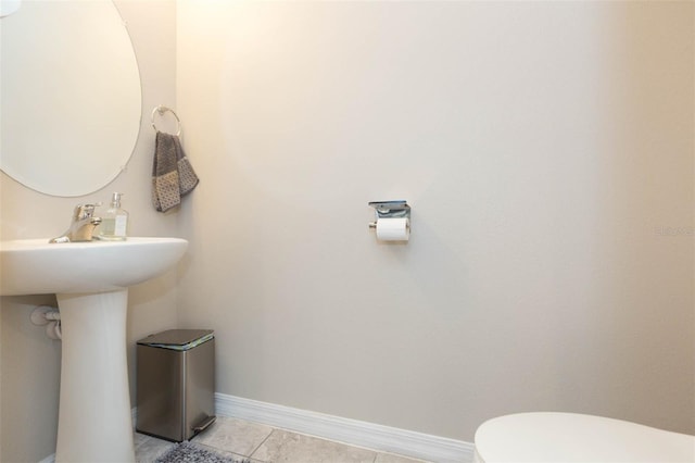 bathroom with tile patterned floors and toilet