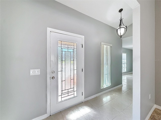 entryway with light tile patterned floors