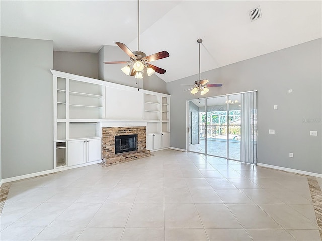 unfurnished living room with built in shelves, ceiling fan, a fireplace, and light tile patterned flooring