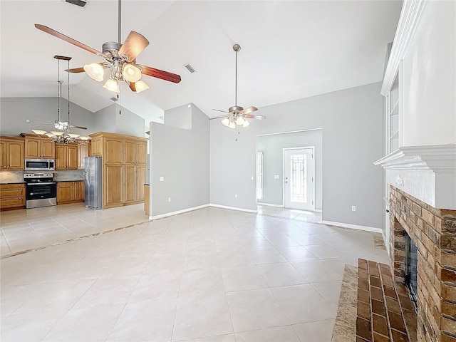 unfurnished living room featuring ceiling fan, vaulted ceiling, light tile patterned floors, and a brick fireplace