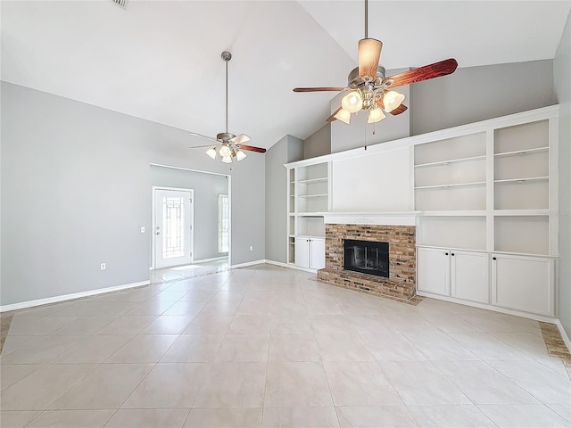 unfurnished living room with ceiling fan, a fireplace, light tile patterned floors, and high vaulted ceiling