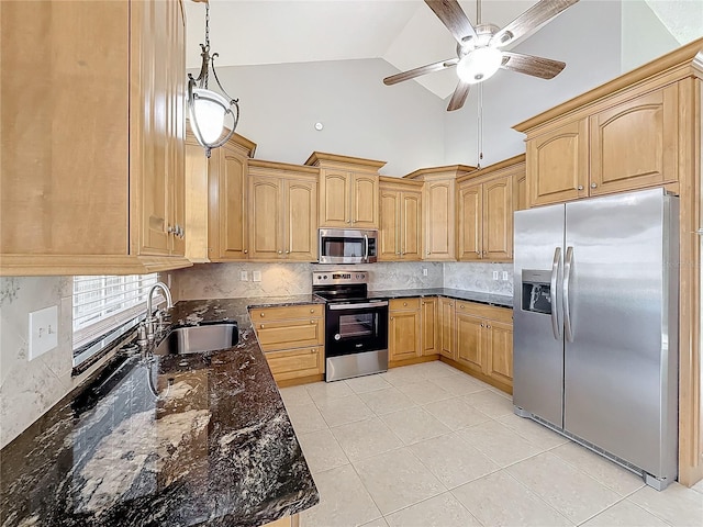 kitchen with sink, stainless steel appliances, backsplash, pendant lighting, and dark stone counters