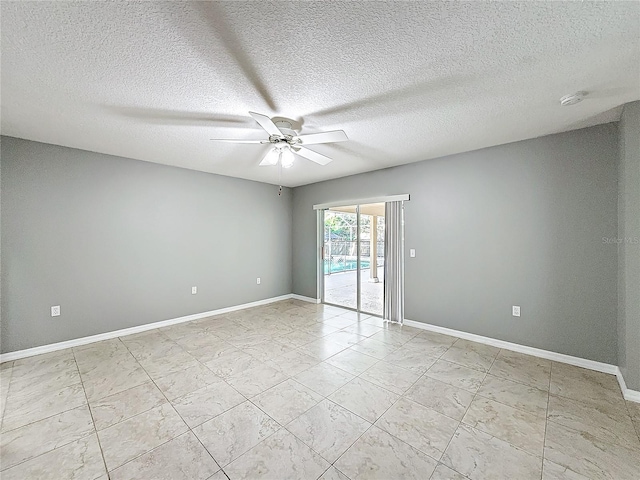 spare room with ceiling fan and a textured ceiling