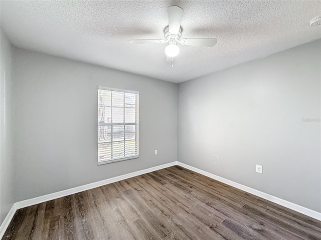 spare room featuring ceiling fan, a textured ceiling, and hardwood / wood-style flooring