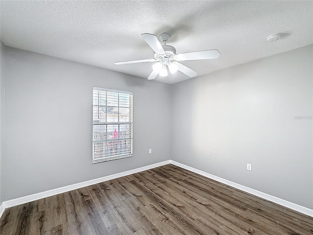 spare room with hardwood / wood-style flooring, ceiling fan, and a textured ceiling