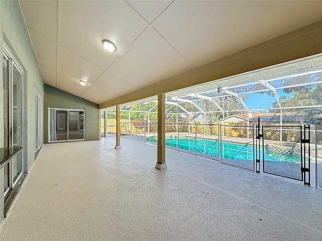 view of swimming pool featuring a lanai and a patio area