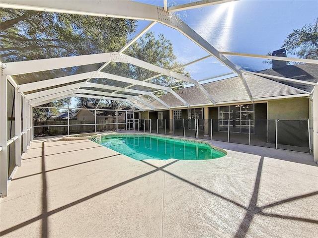 view of swimming pool with a lanai and a patio