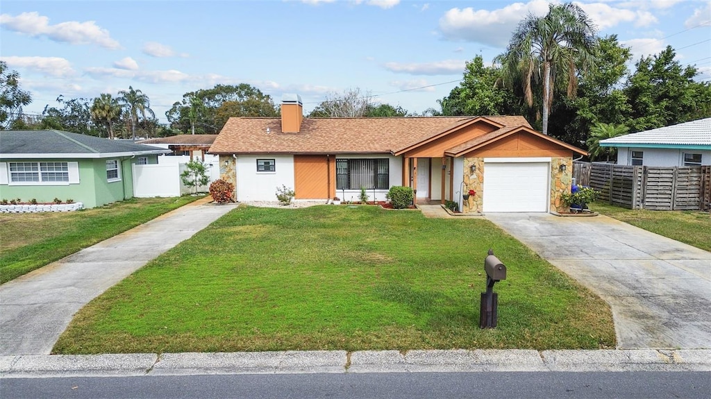 single story home with a front lawn and a garage