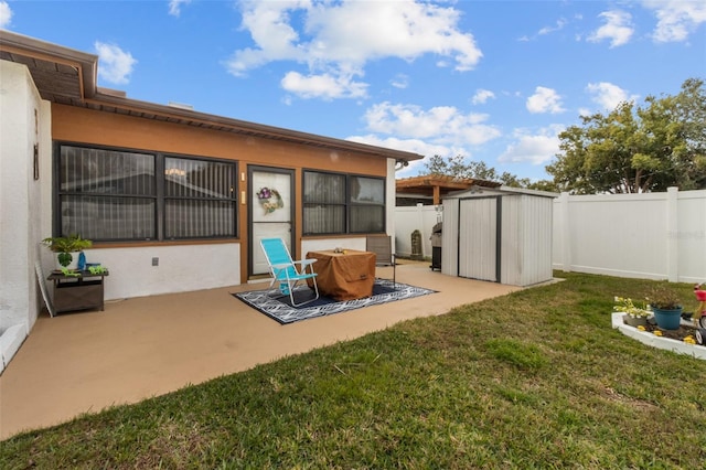 exterior space with a storage unit, a patio area, and a yard