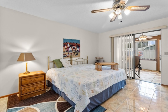 bedroom featuring a textured ceiling and ceiling fan