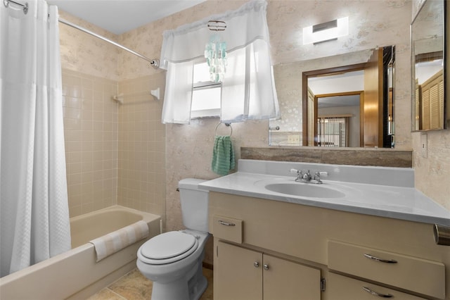 full bathroom featuring toilet, shower / bathtub combination with curtain, and vanity