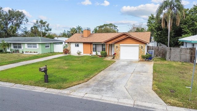 ranch-style house featuring a garage and a front yard