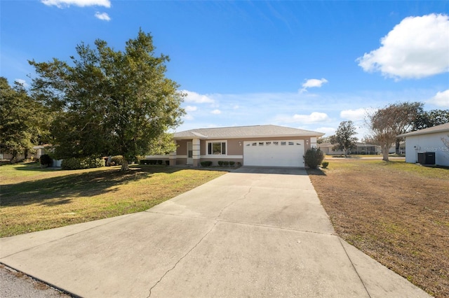 ranch-style house featuring a garage and a front lawn