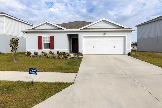 ranch-style home featuring a front lawn and a garage