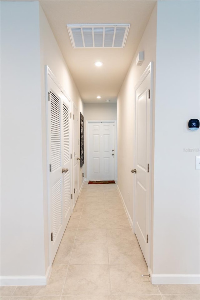 hallway with light tile patterned flooring