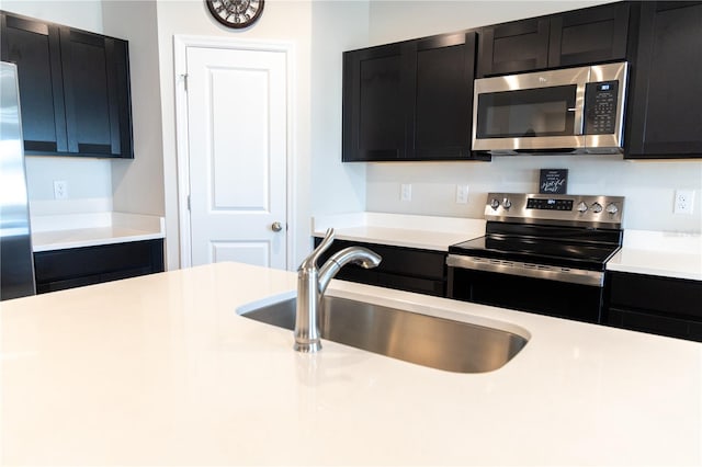 kitchen featuring stainless steel appliances and sink