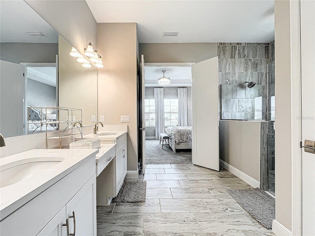 bathroom with a shower and vanity