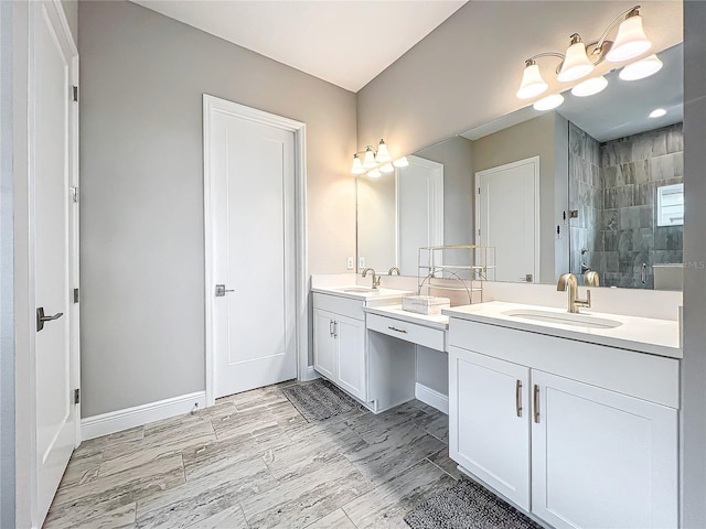 bathroom featuring an enclosed shower and vanity