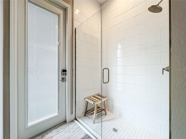 bathroom with a tile shower