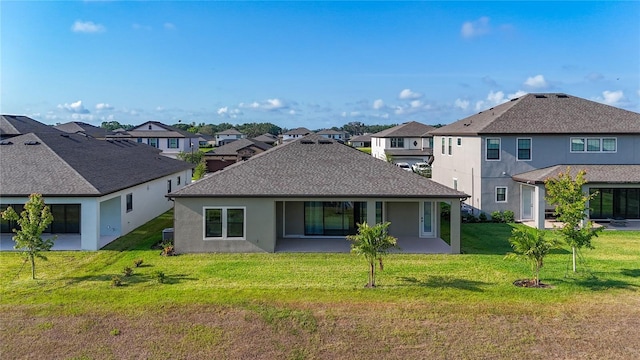 13028 Homestead Ln, Parrish, FL 34219 - rear view of house featuring a residential view, a lawn, and stucco siding