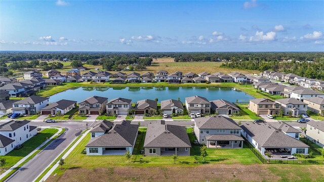 13028 Homestead Ln, Parrish, FL 34219 - aerial perspective of suburban area with a large body of water