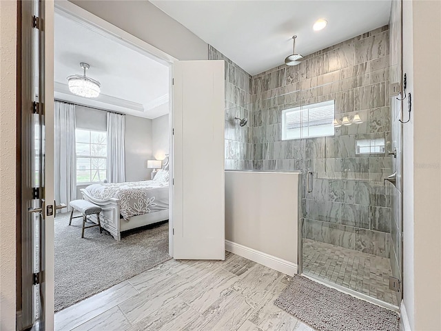 13028 Homestead Ln, Parrish, FL 34219 - ensuite bathroom with plenty of natural light, a stall shower, and baseboards