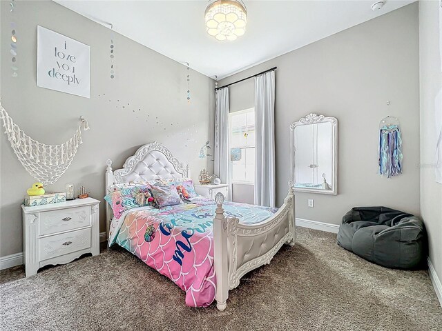13028 Homestead Ln, Parrish, FL 34219 - bedroom with carpet and baseboards